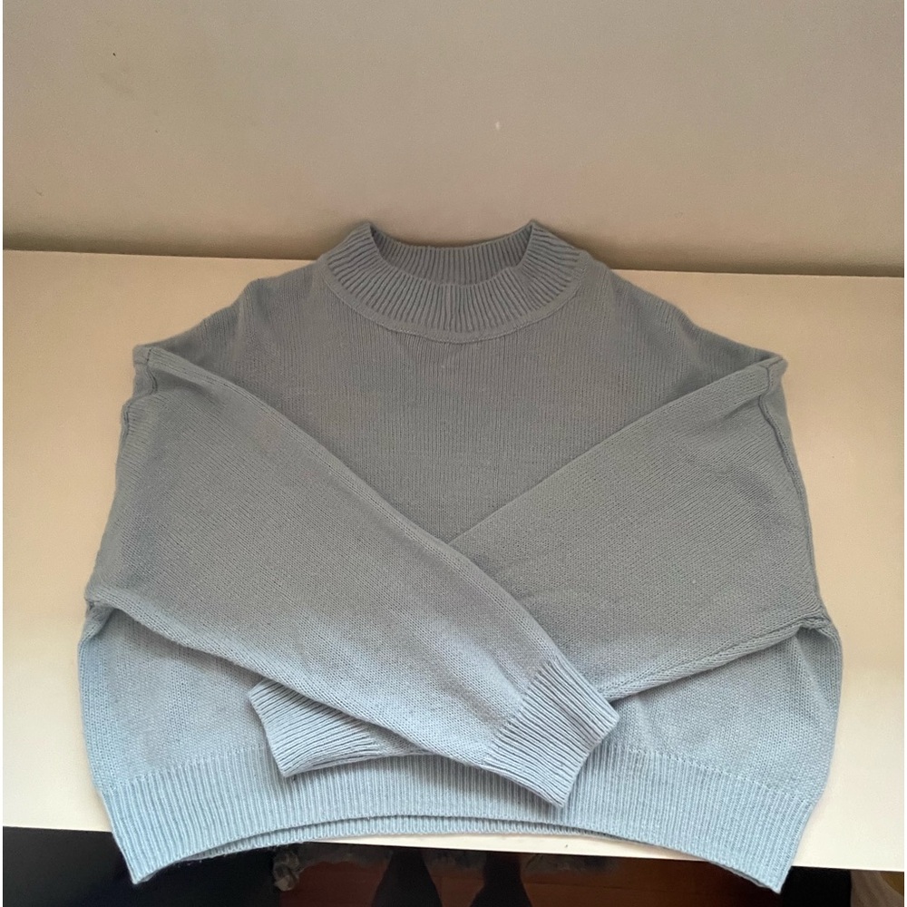 Light blue knitted sweater for women